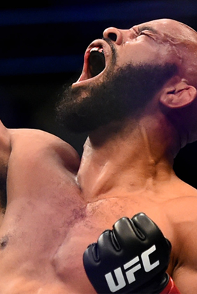 Mighty Mouse UFC wrestler yells with fist clenched