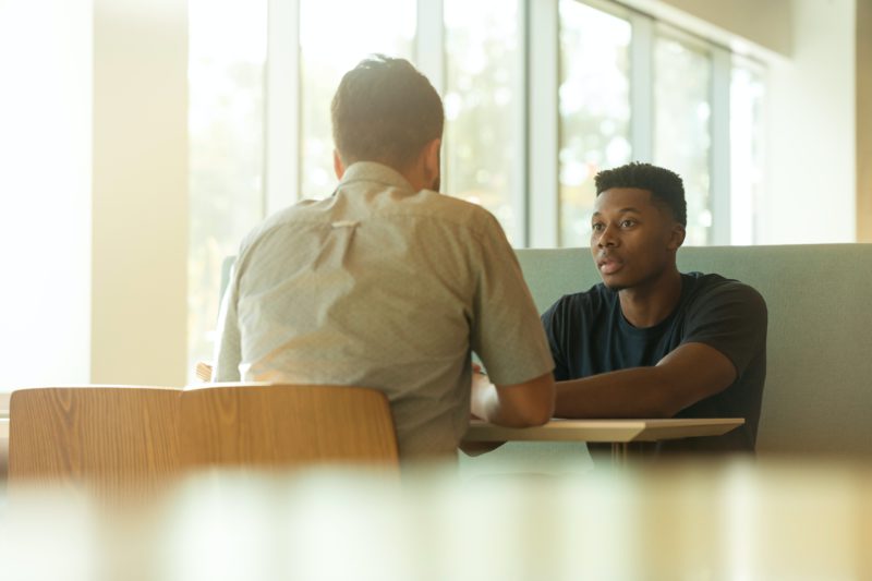 People talking at a table