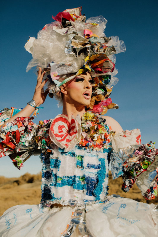 Pattie Gonia wearing an outfit made of trash