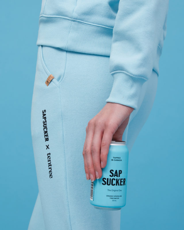 person holding a blue can