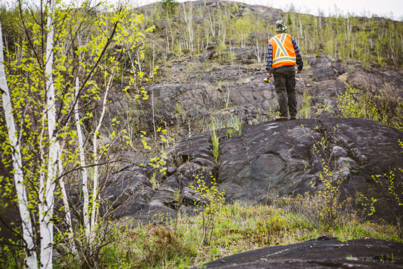 man standing on a rock