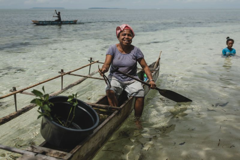 lady in boat with mangrove