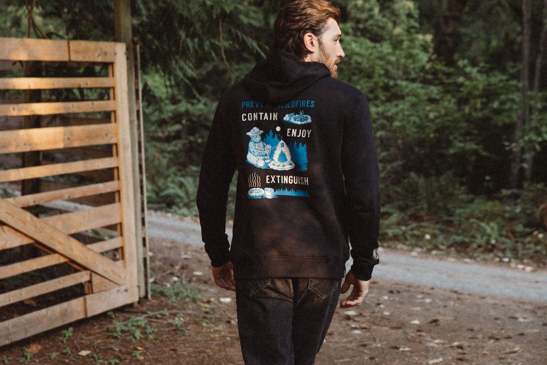 man in smokey bear sweater