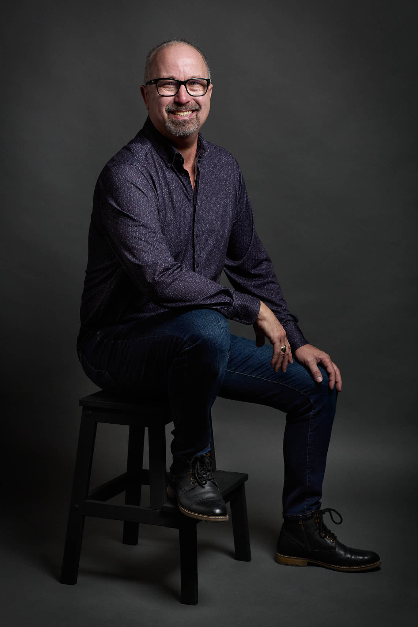 Lee seated in the studio