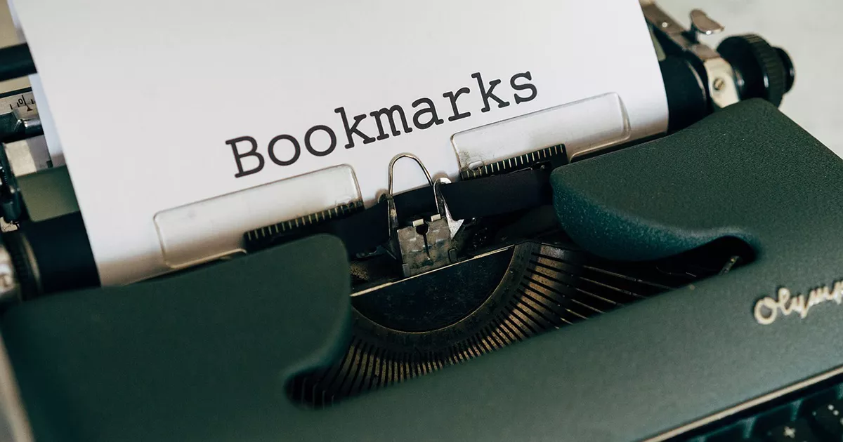 Typewriter with a sheet of paper labeled Bookmarks representing digital bookmark organization