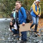 Students on riverbank