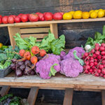Colorful vegetables arranged on table and shelves