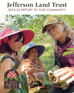 Image of the front cover of the 2024-25 Report to Our Community showing a woman holding something interesting that she's showing to two young girls.