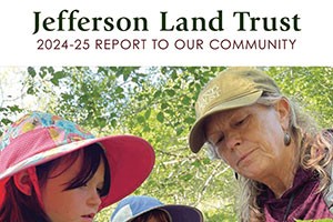Image of the front cover of the 2024-25 Report to Our Community showing a woman holding something interesting that she's showing to two young girls.