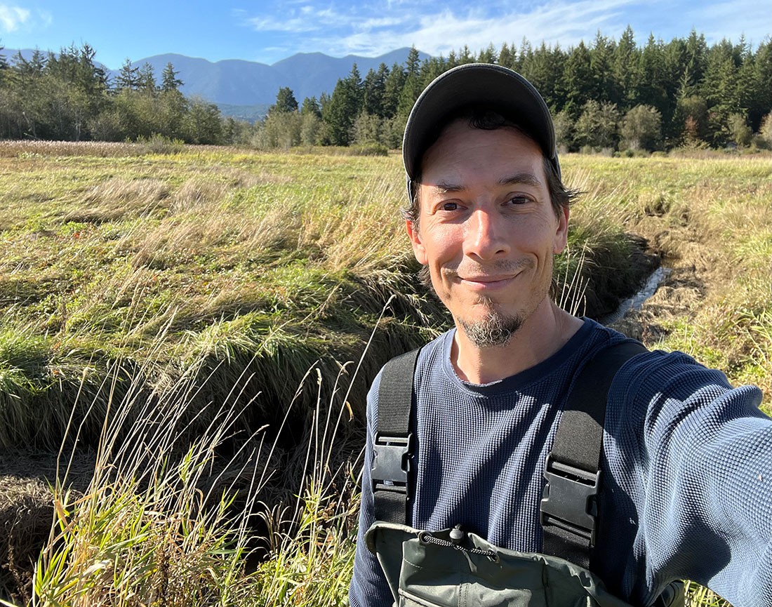 Selfie of man smiling in wetlands