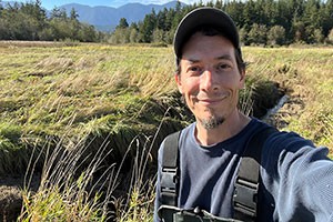 Selfie of man smiling in wetlands
