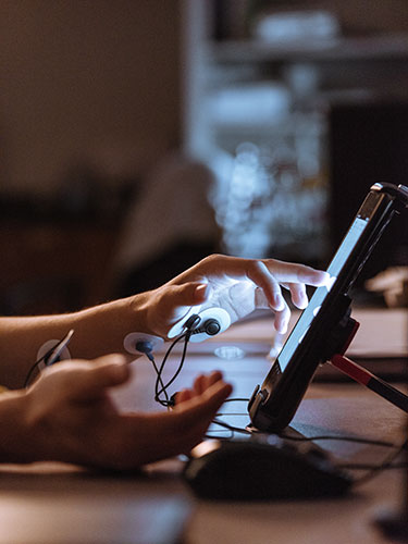 Texas A&M graduate students collect physiological signals while completing a stress-inducing game on a tablet.