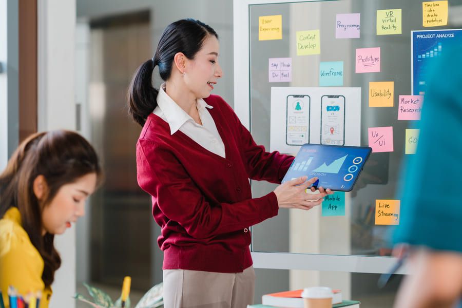 Woman presenting analytics data using a tablet