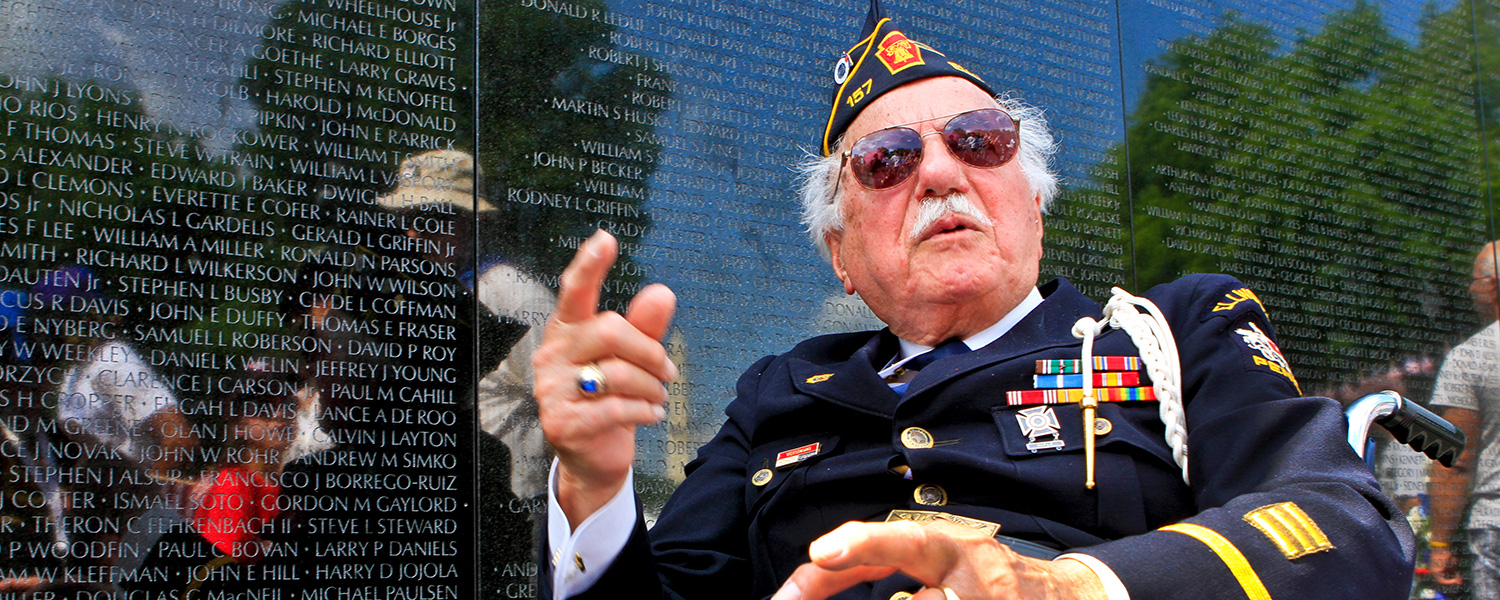 Vietnam Veteran in Front of Memorial