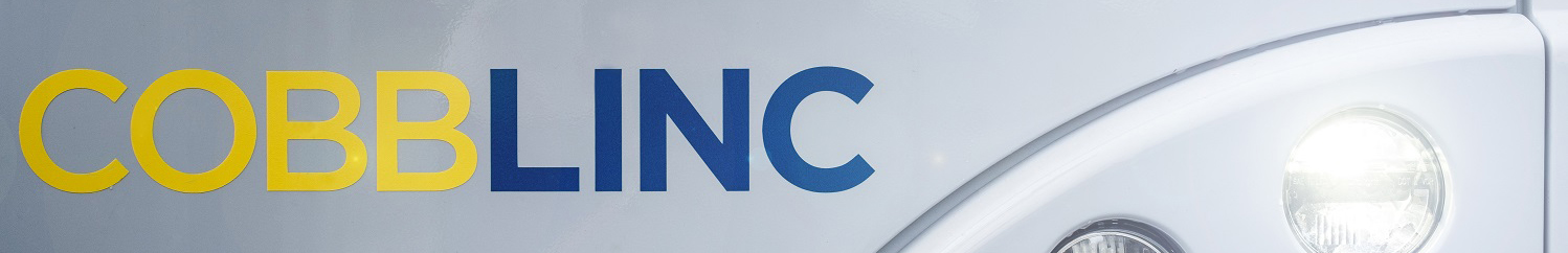 Partial view of front of CobbLinc bus.