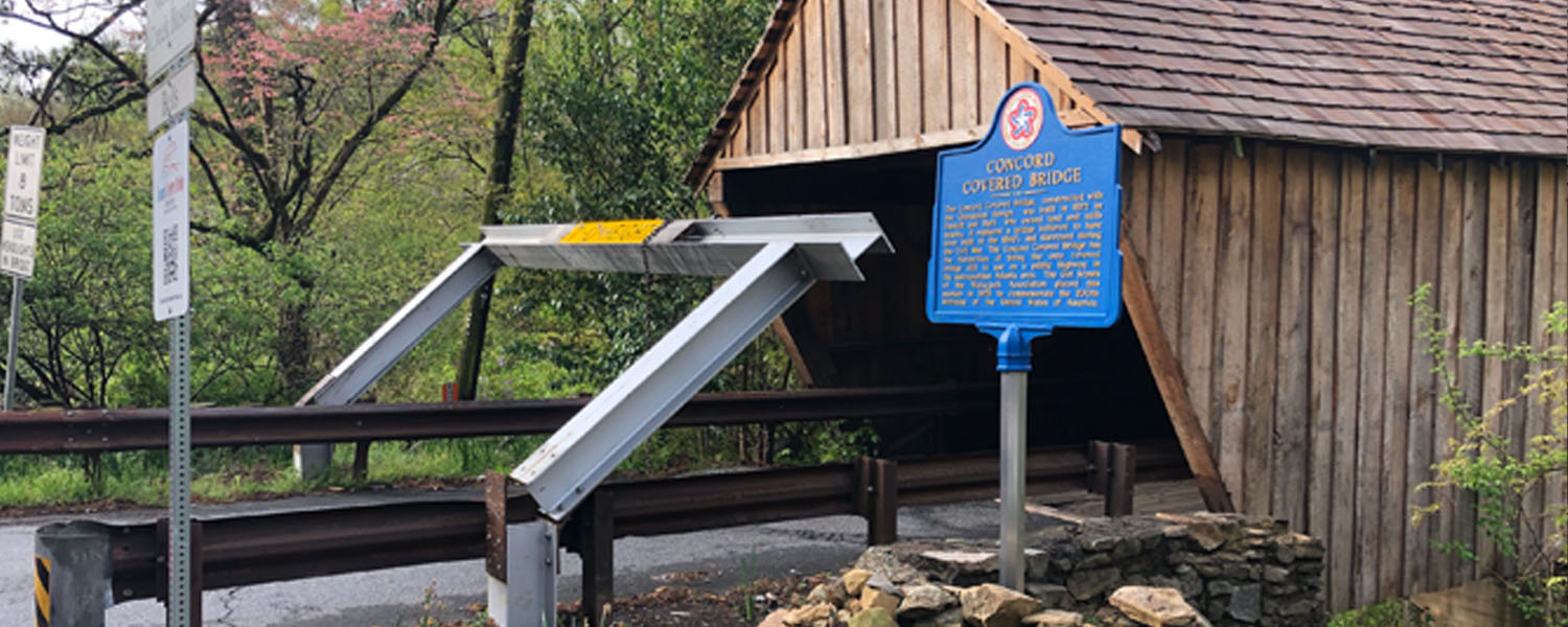 picture of bent beam outside of the Covered Bridge