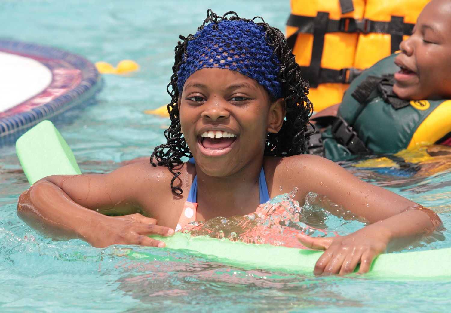 Photo of a girl swimming at Seven Springs
