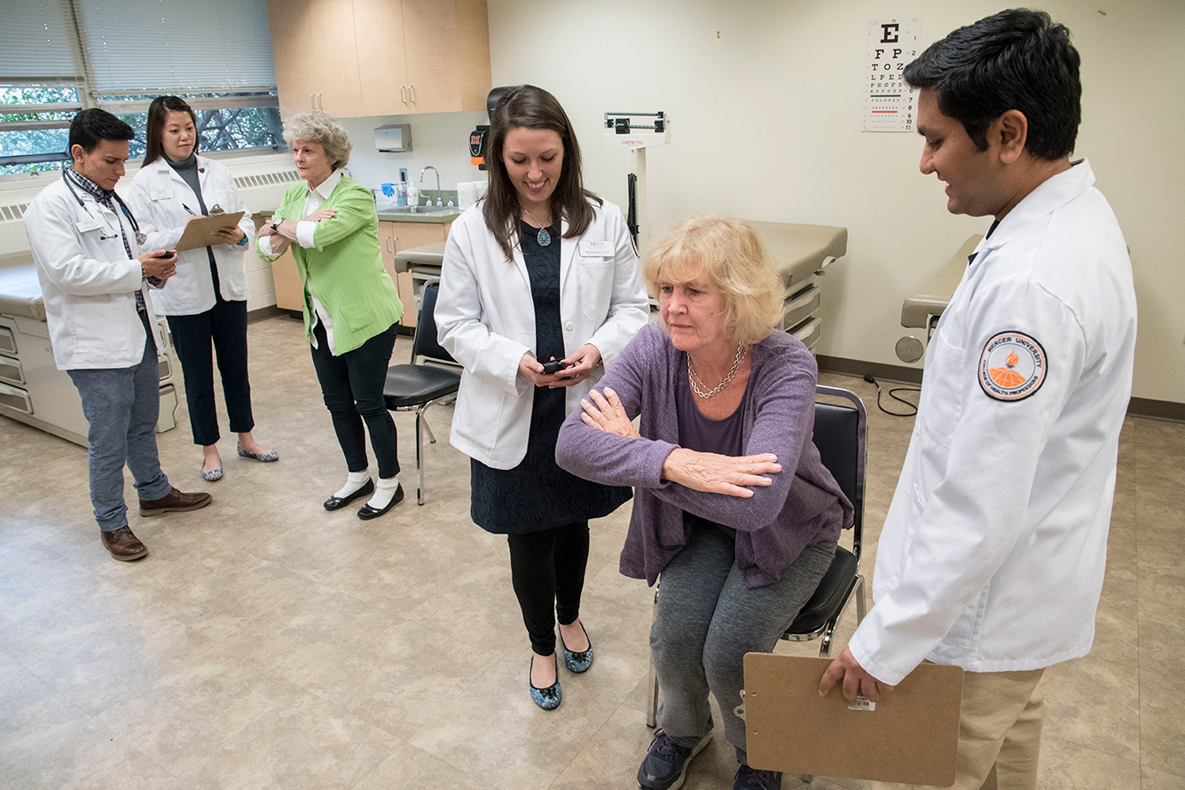 Senior at doctor's office balancing