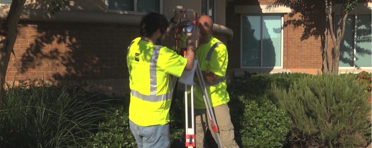 picture of team with air monitoring device