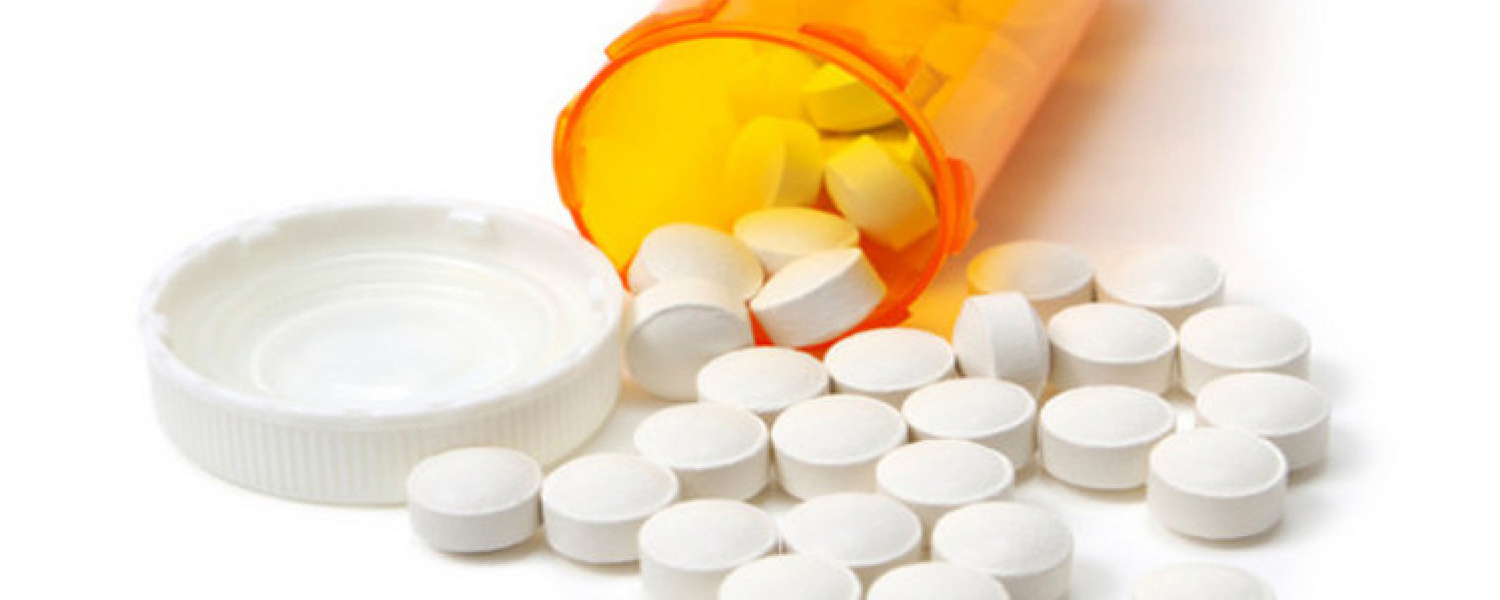 Pills spilling out of a bottle