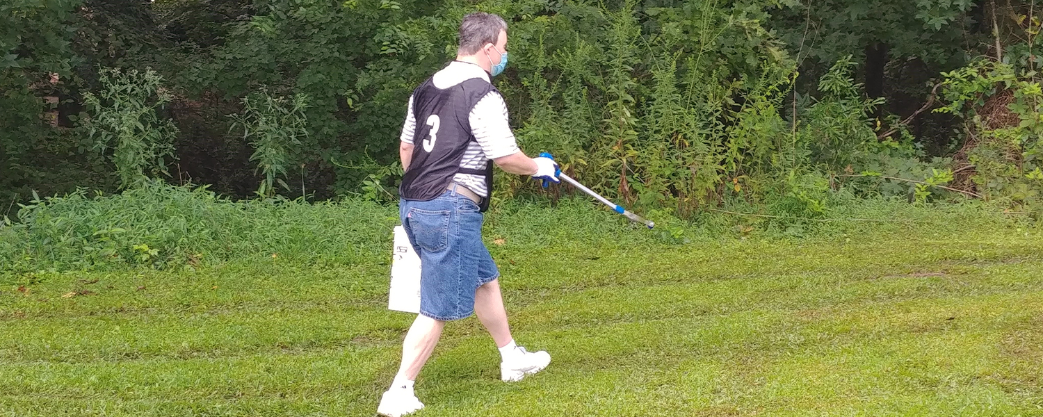 man cleaning park
