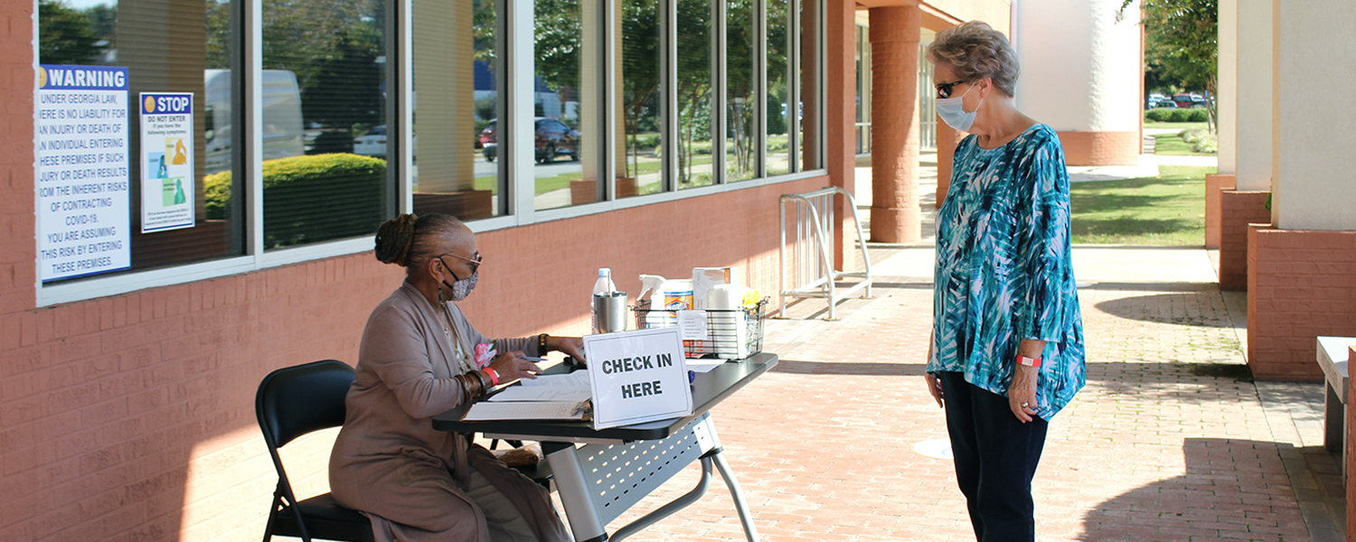woman checking in resident at CSS