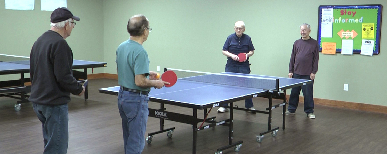 picture of seniors playing table tennis