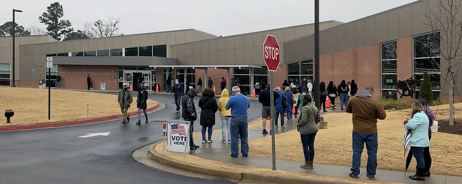 line of people waiting to vote at North Cobb Regional Library