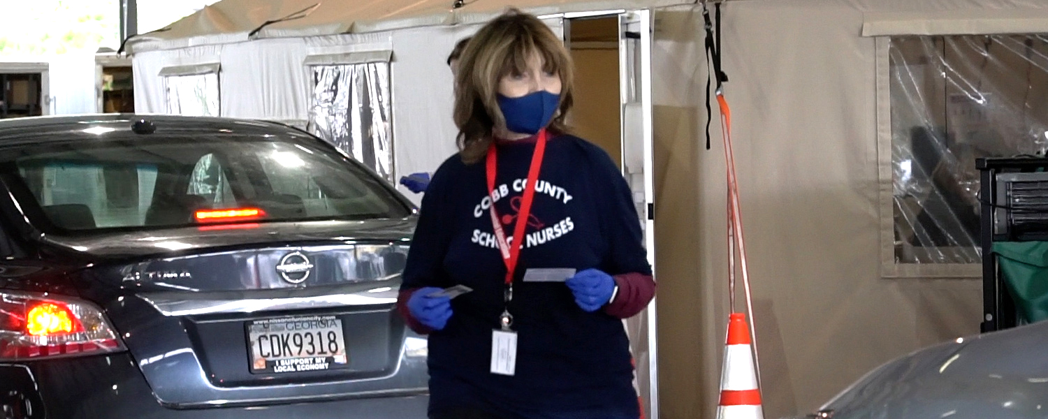 picture of a school nurse at vaccination event