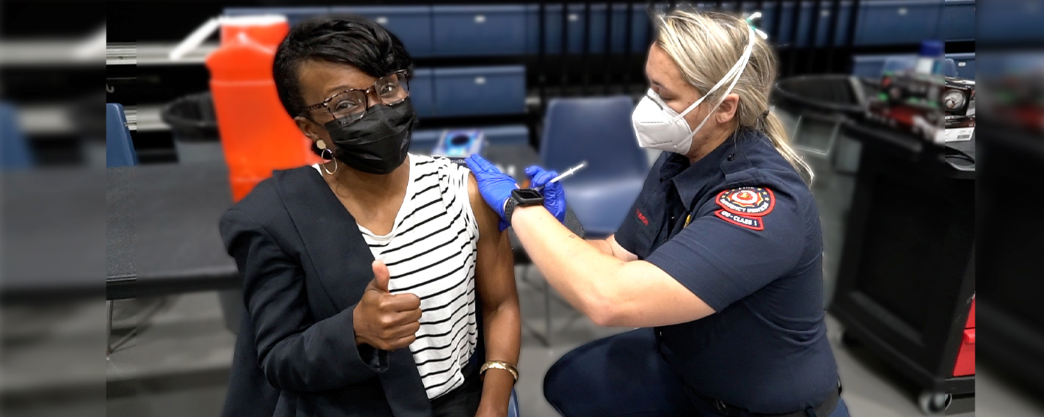 picture of chairwoman cupid receiving vaccine