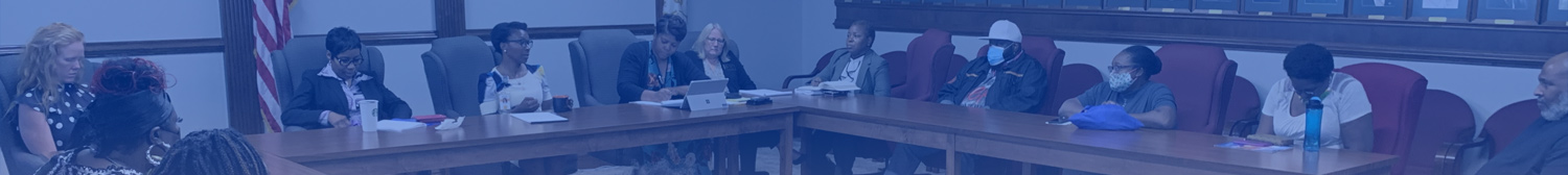 picture of a meeting in the board of commissioners room