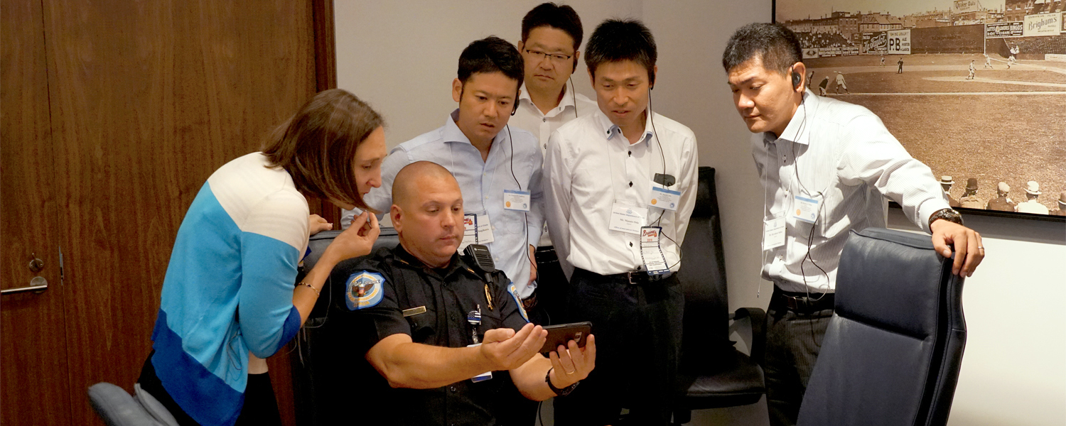 picture of japanese contigent with Cobb police officer