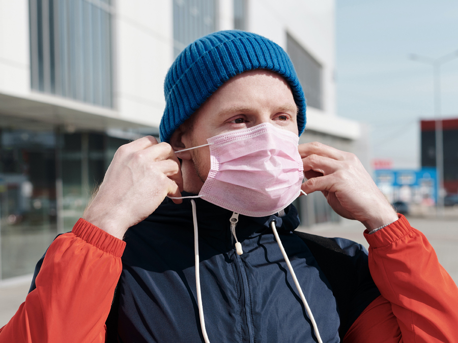 Man putting on mask