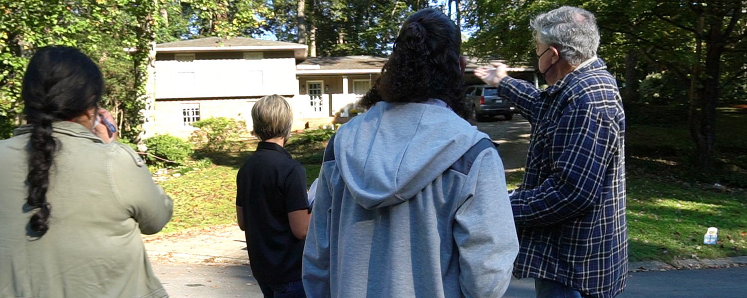 picture of group touring Cobb storm damage