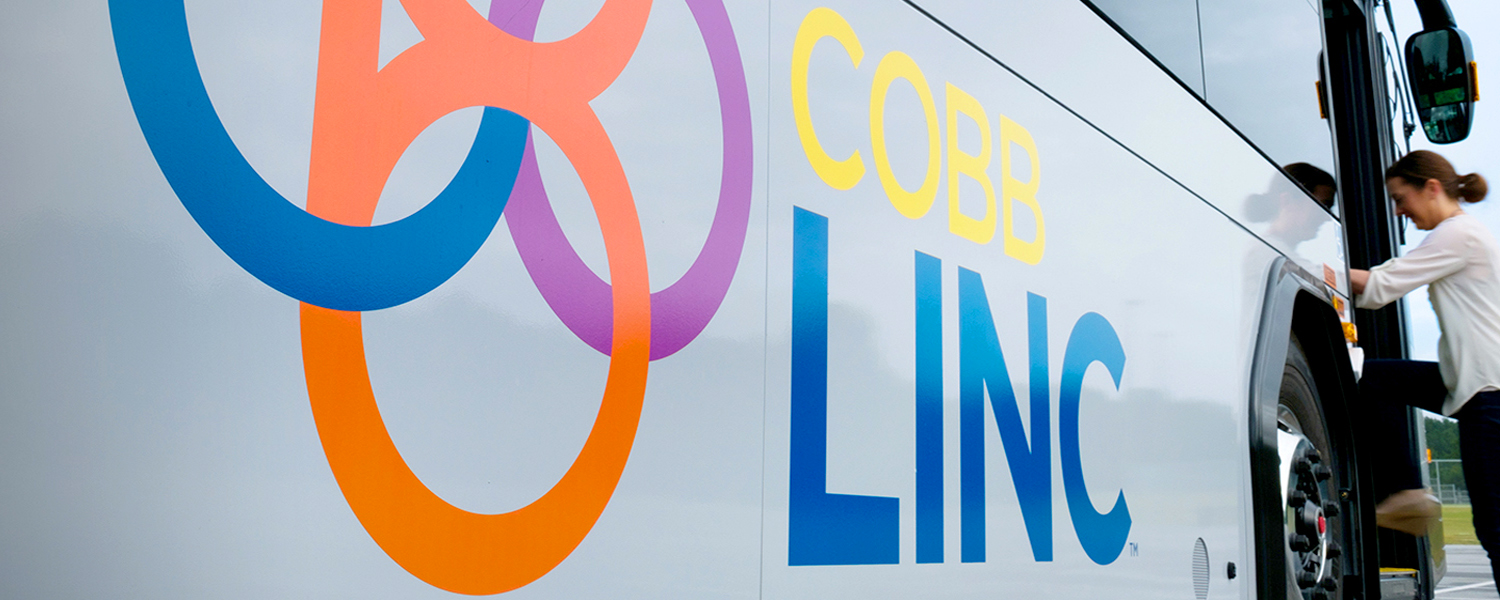 Thumbnail picture of CobbLinc Bus with lady boarding.