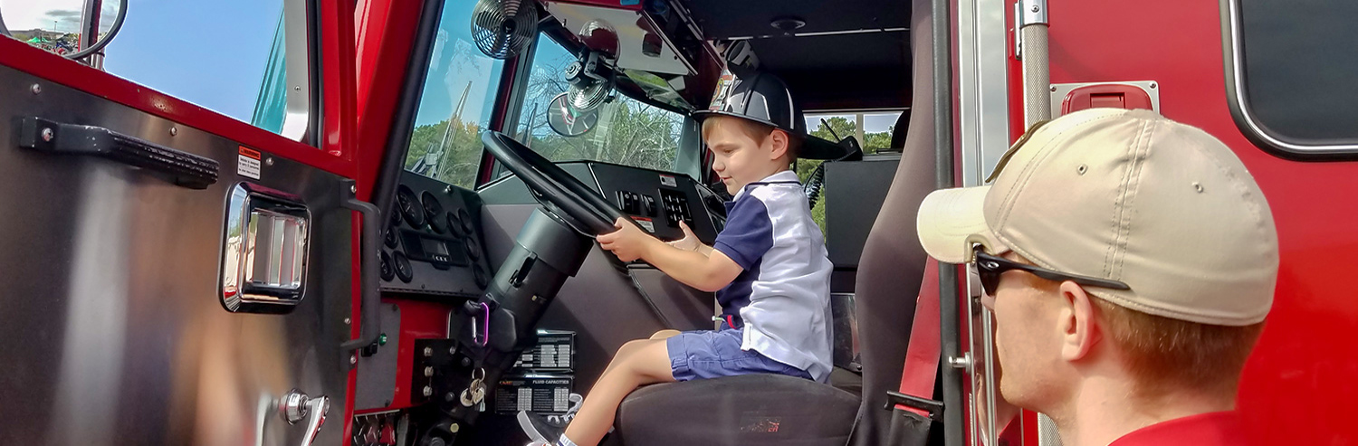 Safety Village Kid in Firetruck