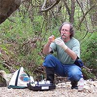 Man looking at water composition