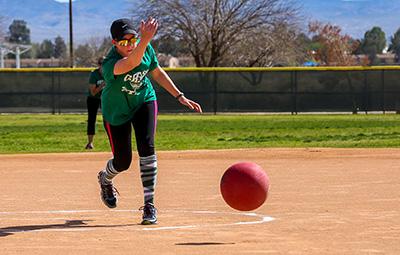 Kickball player pitching