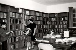 black and white photograph of interior of old Kennesaw library with patrons