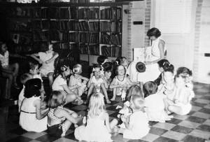 black and white photograph of storytime inside the old Sweetwater Library