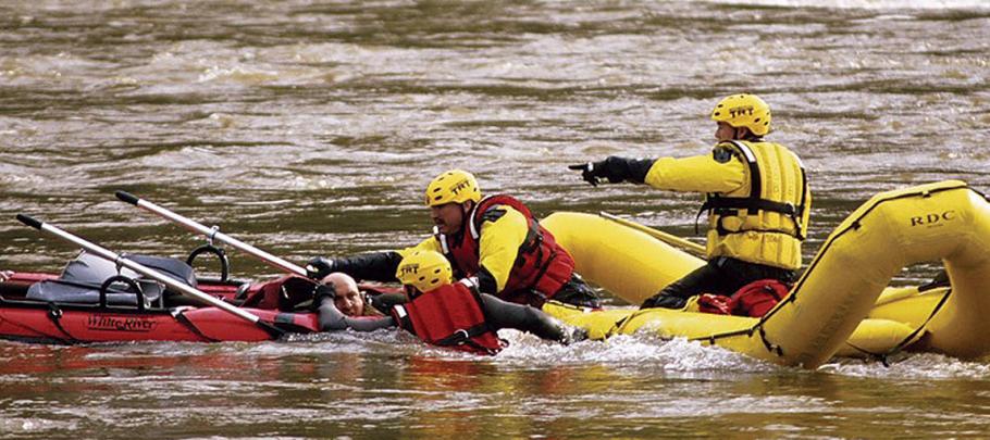 Rescue team saving man in water