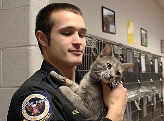 Animal Services Officer with Cat