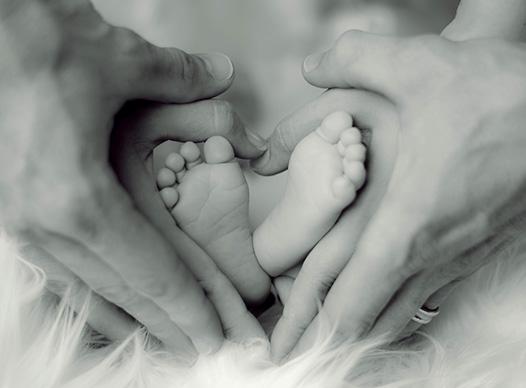 Baby Footprints and Parent Hands