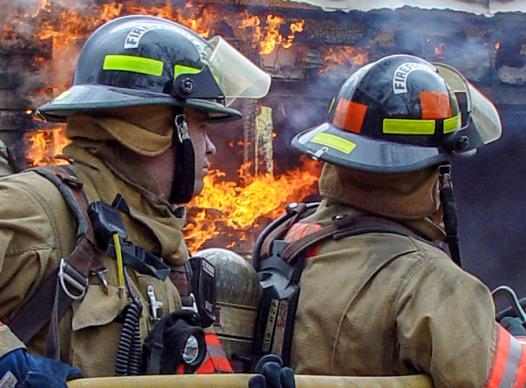 Firemen Putting out House Fire