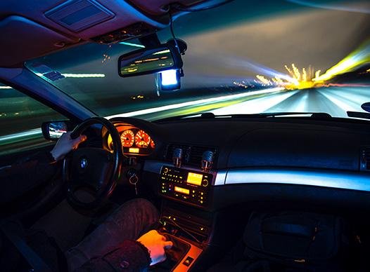 Speeding Car at Night
