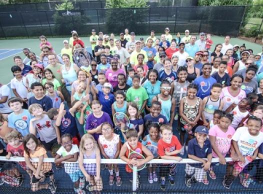 Large group of happy tennis players
