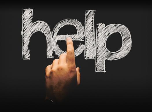 picture of the word help with finger pointing at it