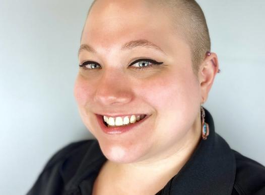 Headshot of Marie (woman) smiling.