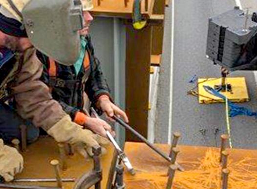 Welders on girders