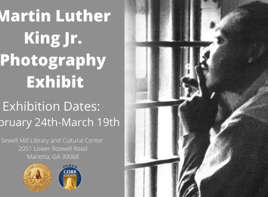 Black and White image of Martin Luther King Jr staring out a window